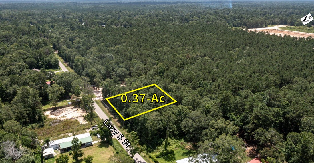 0 Lazy S Street Splendora, TX 77372 - Photo 2 of 6 a sign that is sitting on a pole