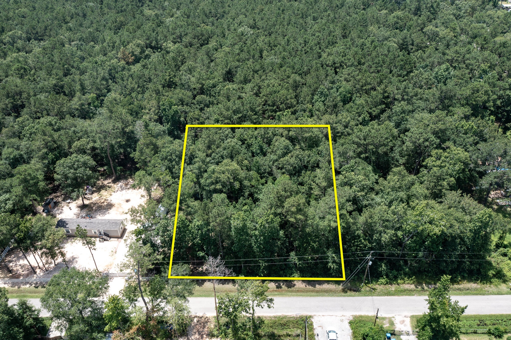 0 Lazy S Street Splendora, TX 77372 - Photo 3 of 6 a view of a back yard