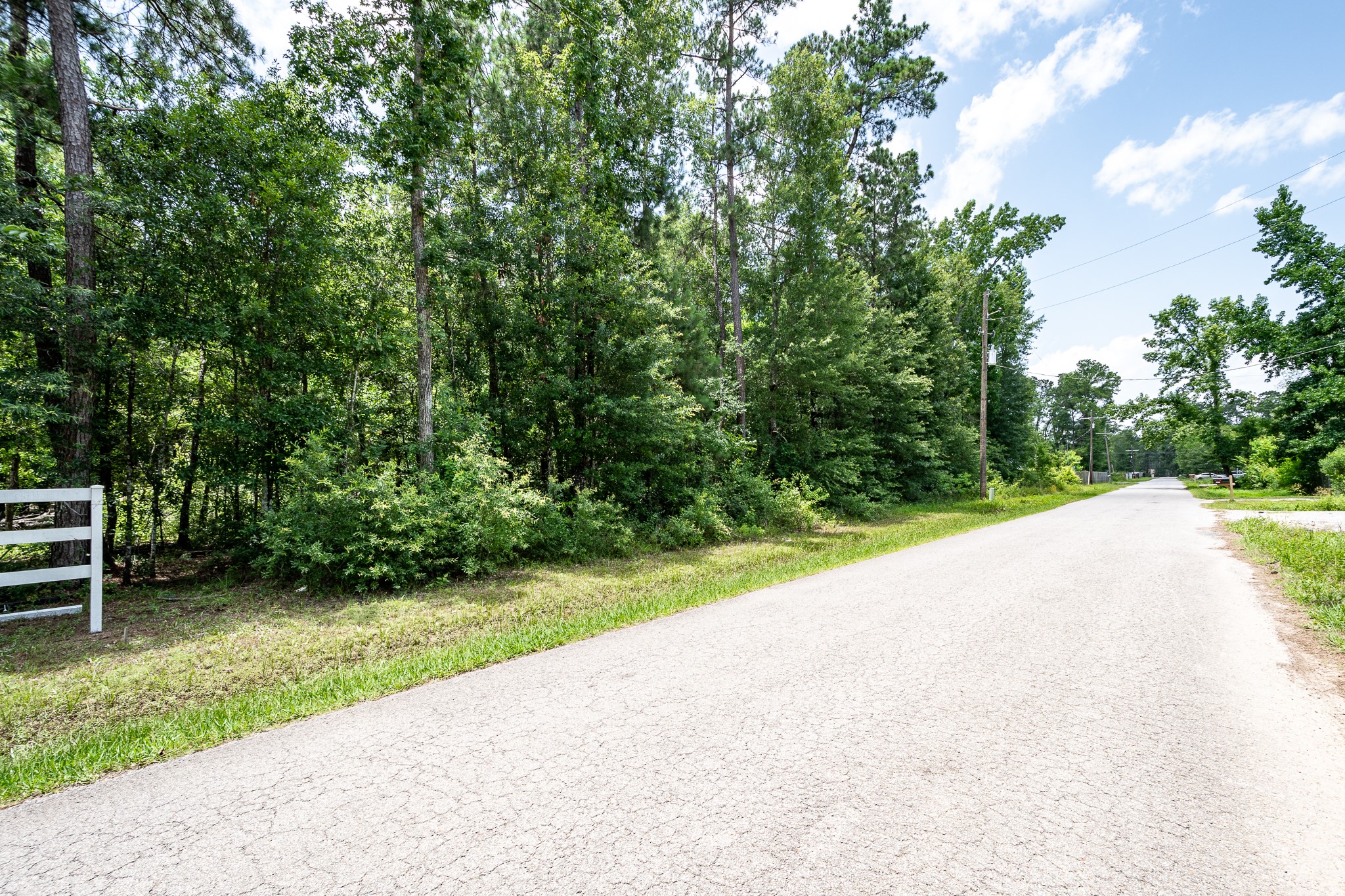 0 Lazy S Street Splendora, TX 77372 - Photo 5 of 6 a view of a street with a trees