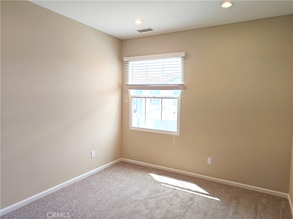 169 Rodeo Irvine, CA 92602 - Photo 11 of 15 an empty room with a window