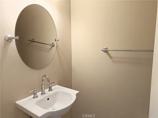 a bathroom with a sink and mirror