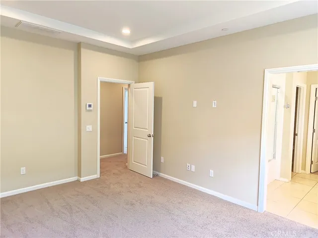 an empty room with closet area