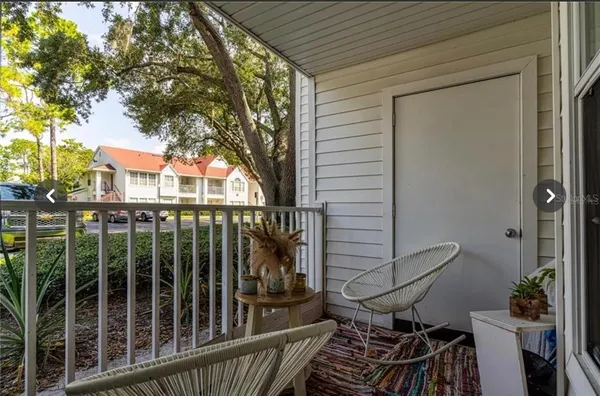a view of a balcony with a potted plant