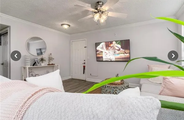 a bedroom with a bed and ceiling fan