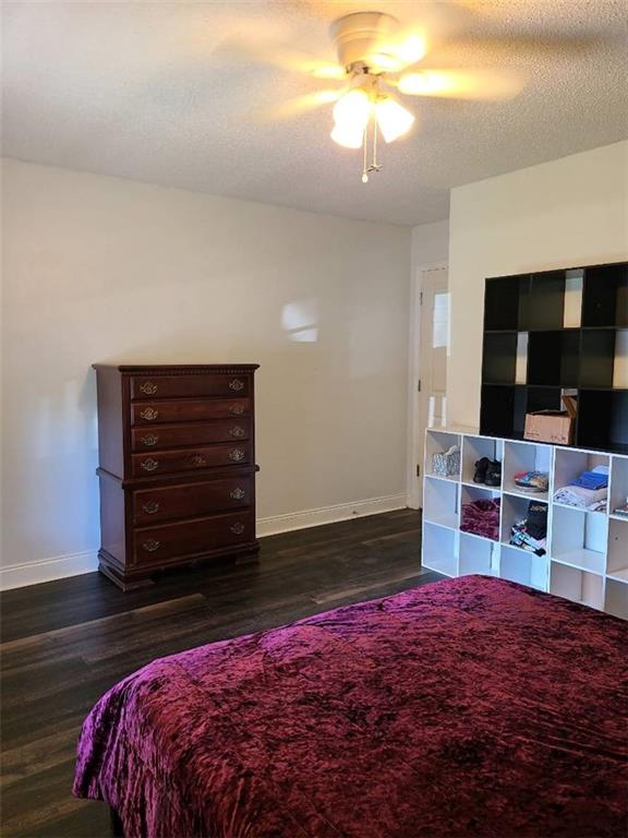 805 Gose Road Forsyth, GA 31029 - Photo 5 of 29 a bedroom with a bed and flat screen tv
