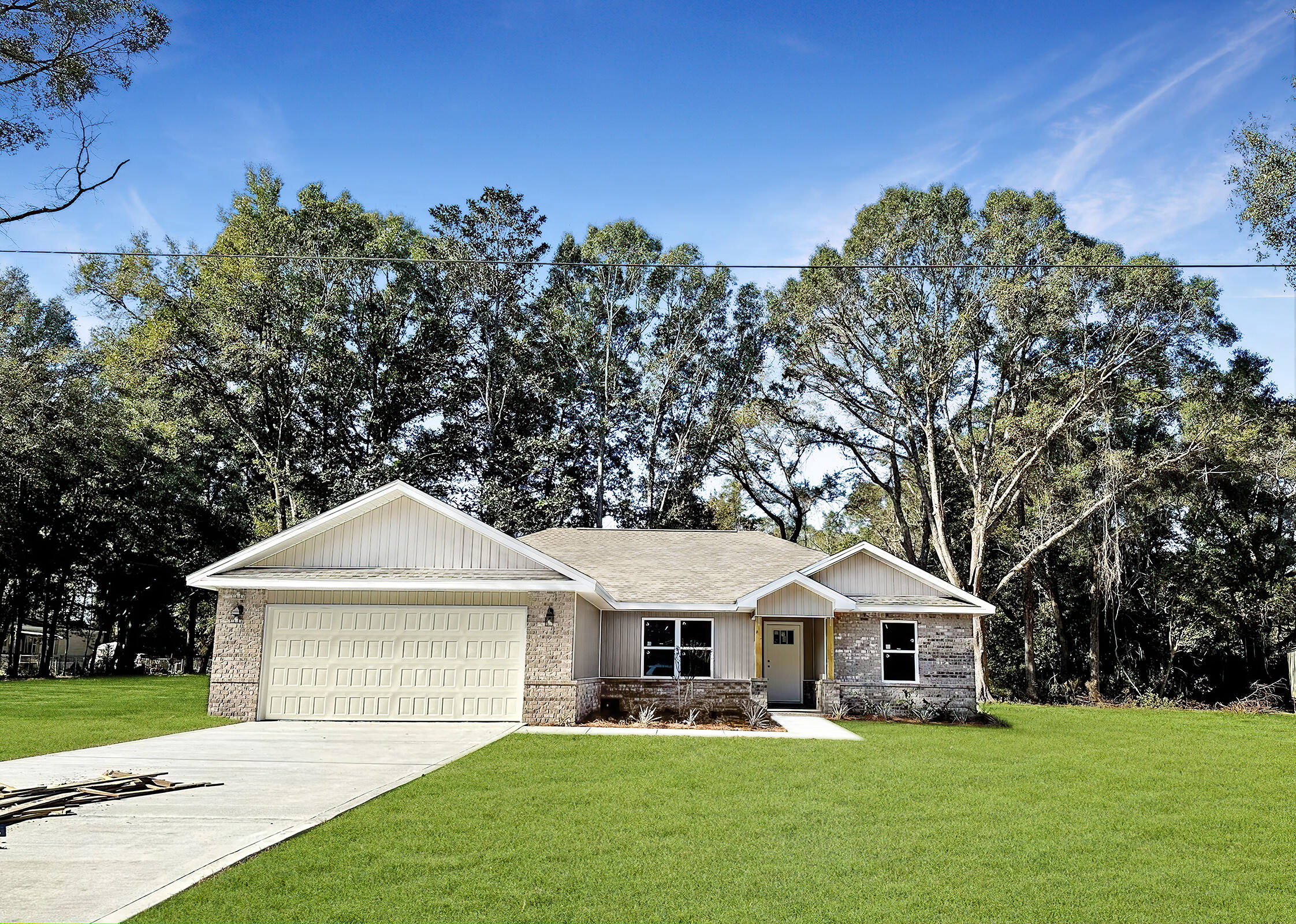 3028 Adams Road Crestview, FL 32536 - Photo 1 of 6 a front view of a house with a yard