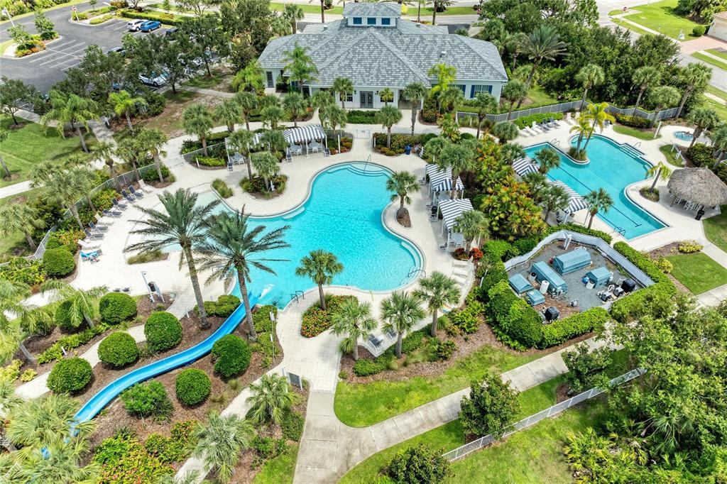 12642 Harney Street Venice, FL 34293 - Photo 61 of 85 an aerial view of a house with a yard and lake view