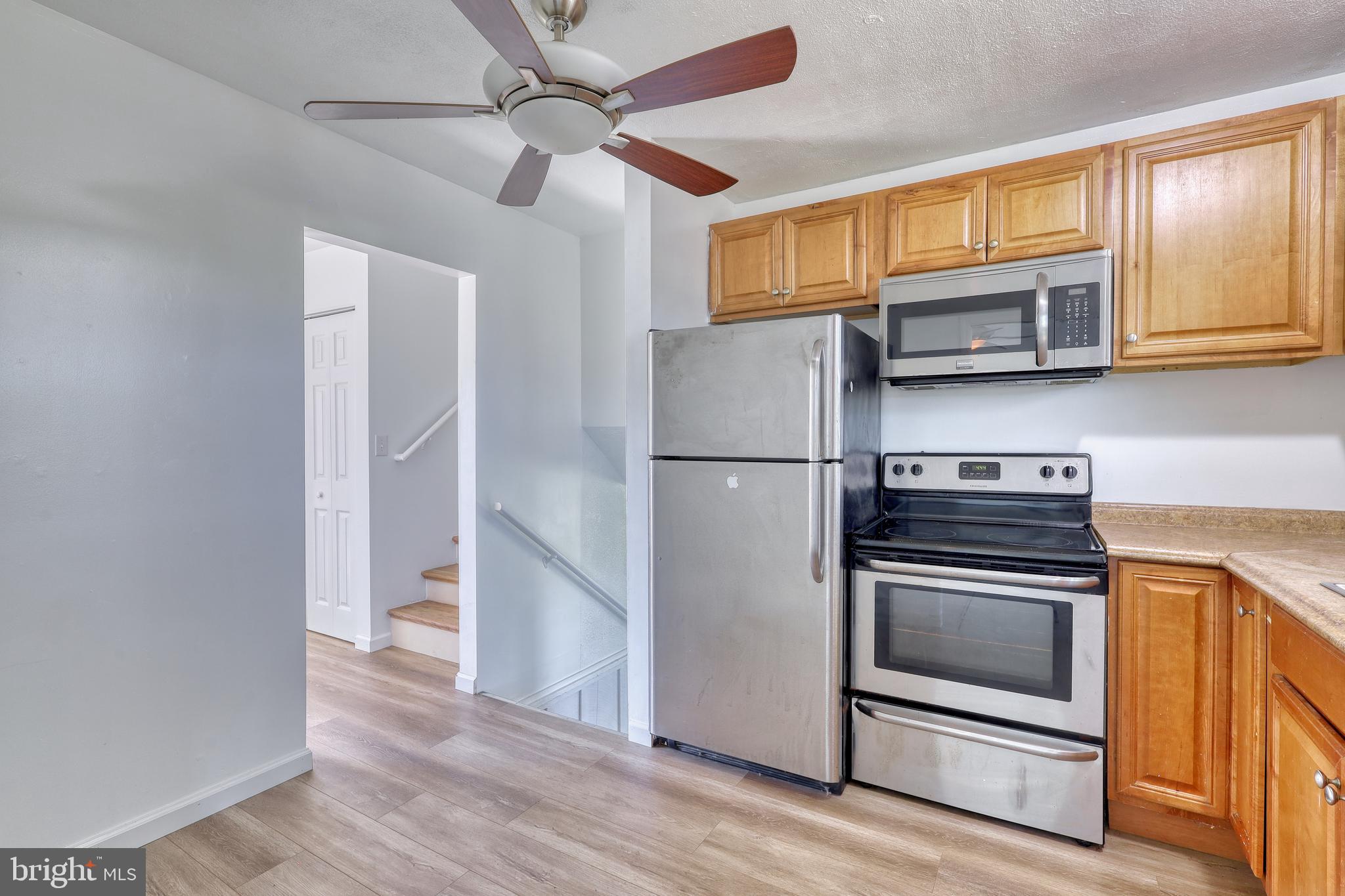 125 Ramblewood Road Pennsylvania Furnace, PA 16865 - Photo 11 of 36 a kitchen with stainless steel appliances granite countertop a refrigerator and a stove top oven
