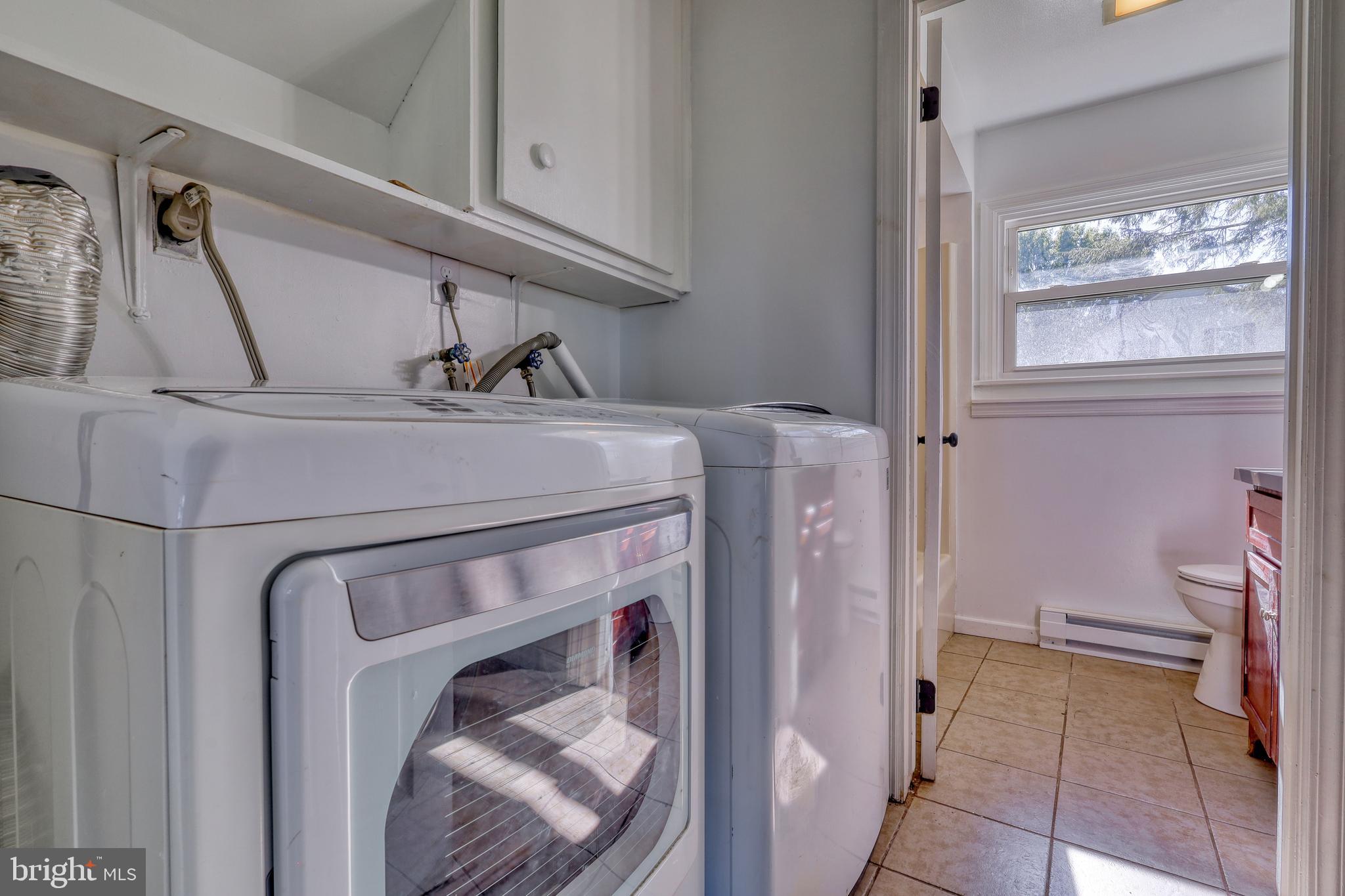125 Ramblewood Road Pennsylvania Furnace, PA 16865 - Photo 26 of 36 a utility room with dryer and washer
