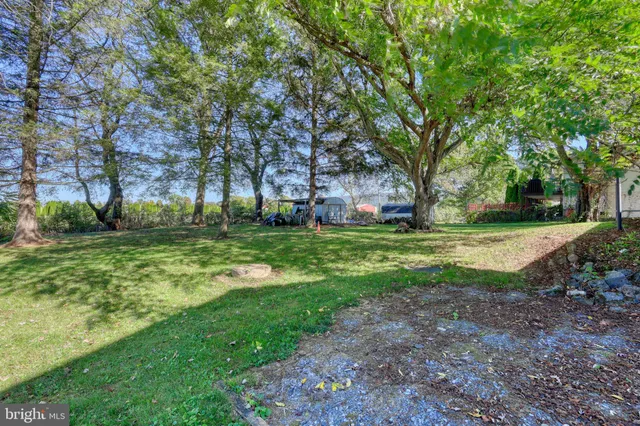 a front view of house with a garden