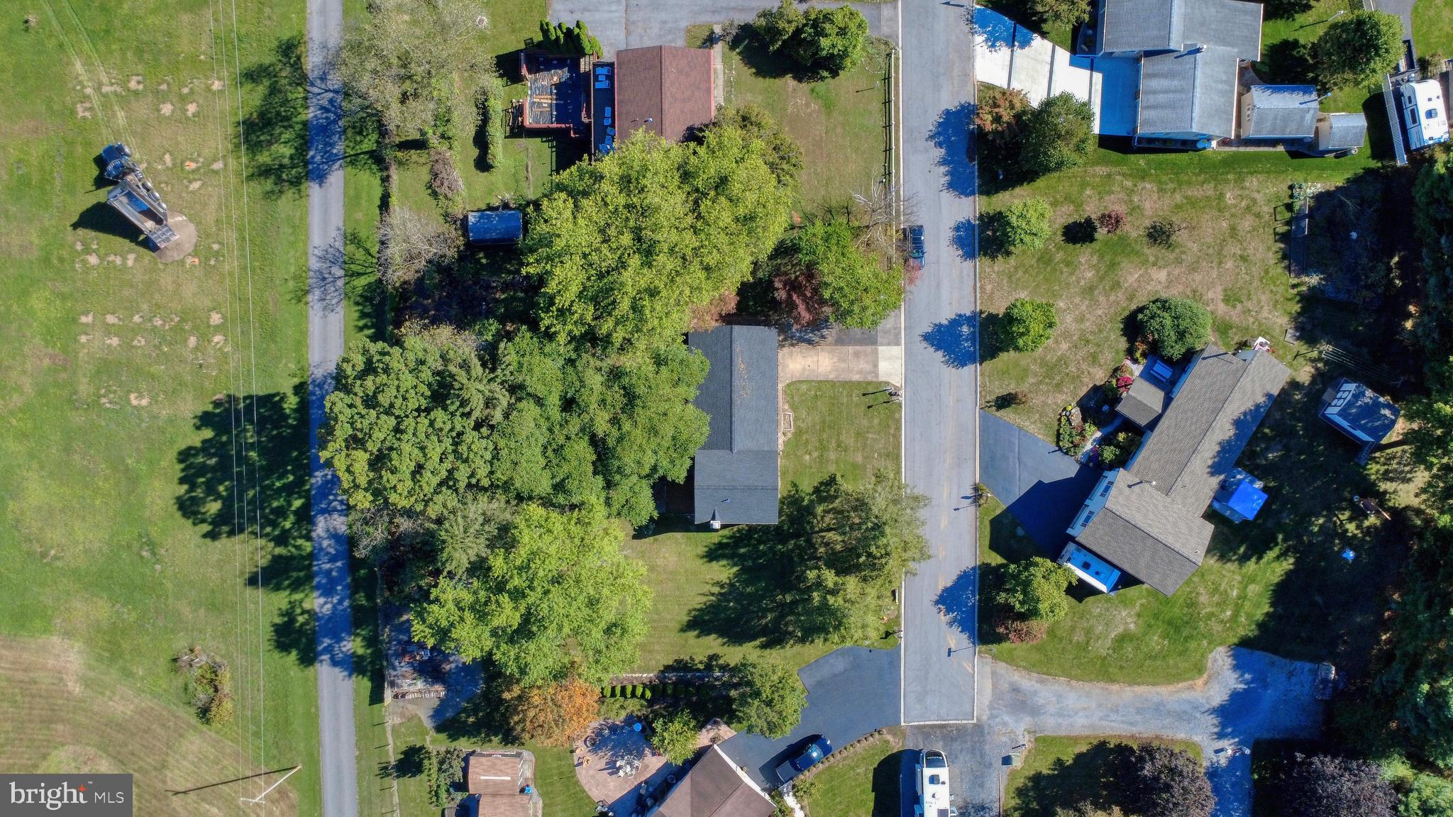 125 Ramblewood Road Pennsylvania Furnace, PA 16865 - Photo 35 of 36 an aerial view of a house with a yard and garden