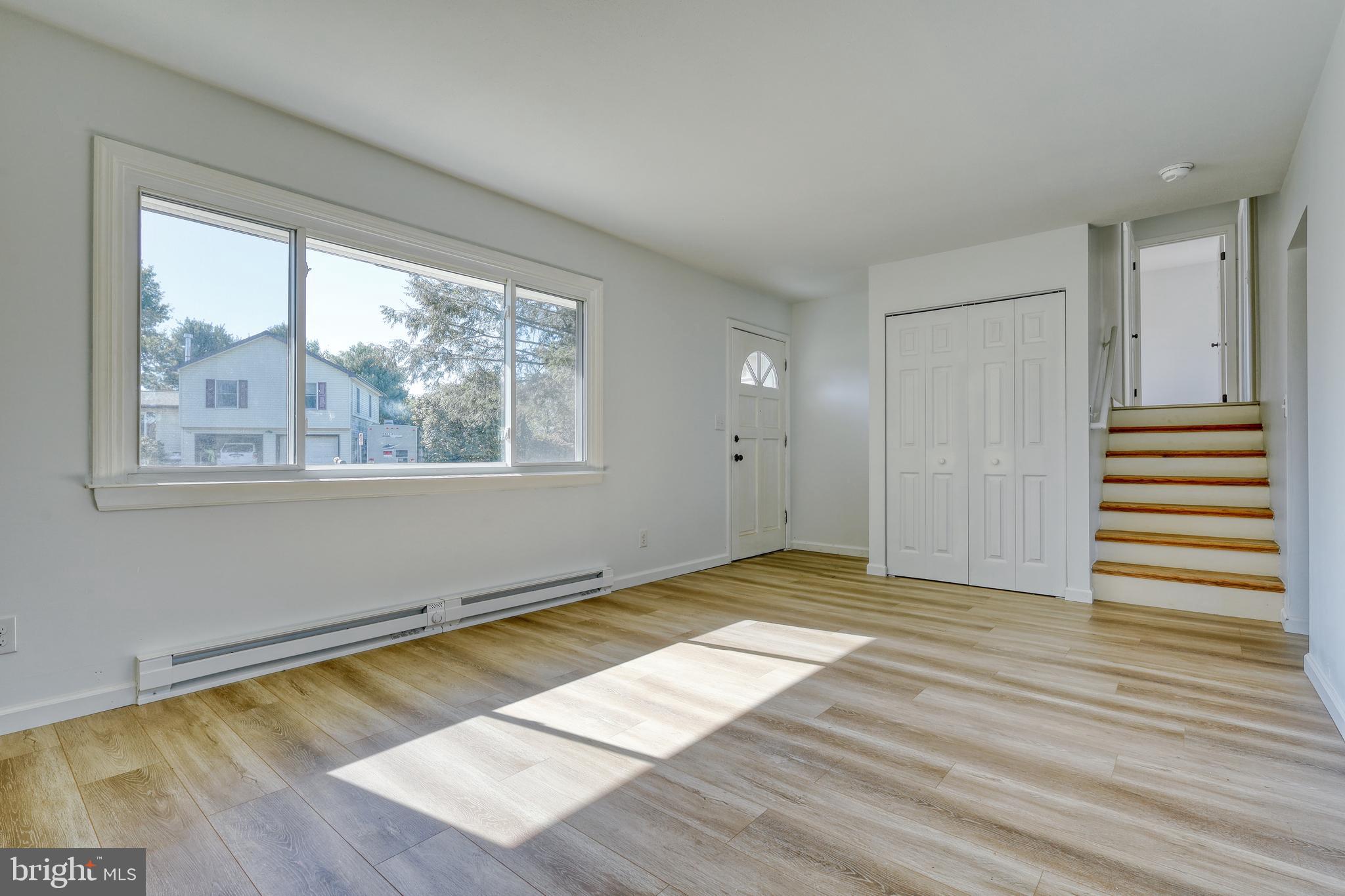 125 Ramblewood Road Pennsylvania Furnace, PA 16865 - Photo 6 of 36 a view of empty room with wooden floor and fan