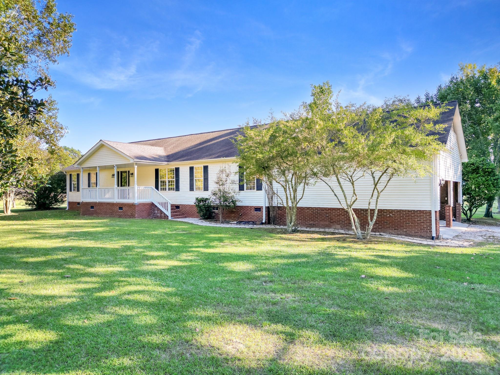 2716 Camp Creek Road Lancaster, SC 29720 - Photo 1 of 47 a house view with swimming pool and garden
