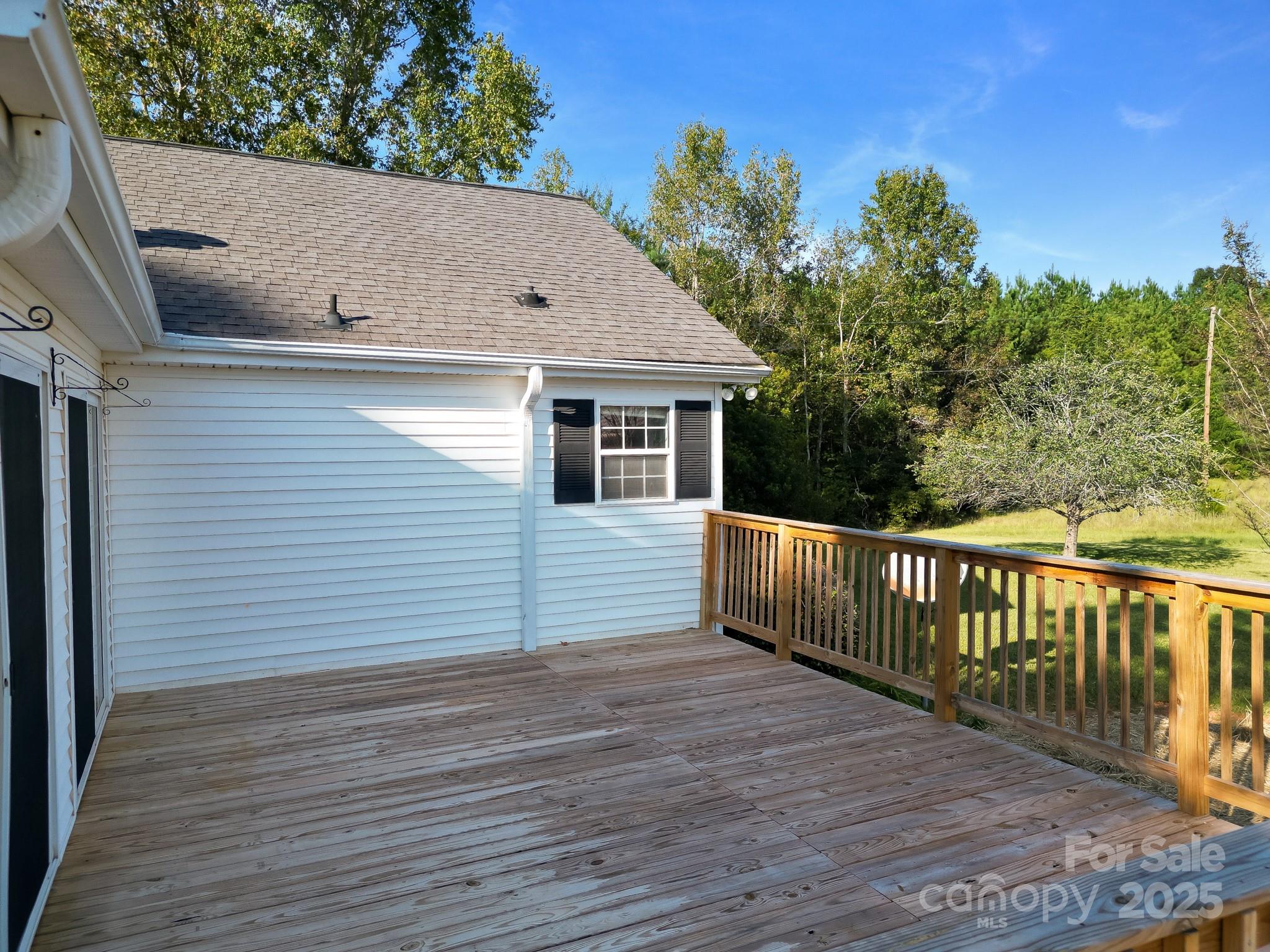 2716 Camp Creek Road Lancaster, SC 29720 - Photo 11 of 47 a view of a white house with a wooden floor