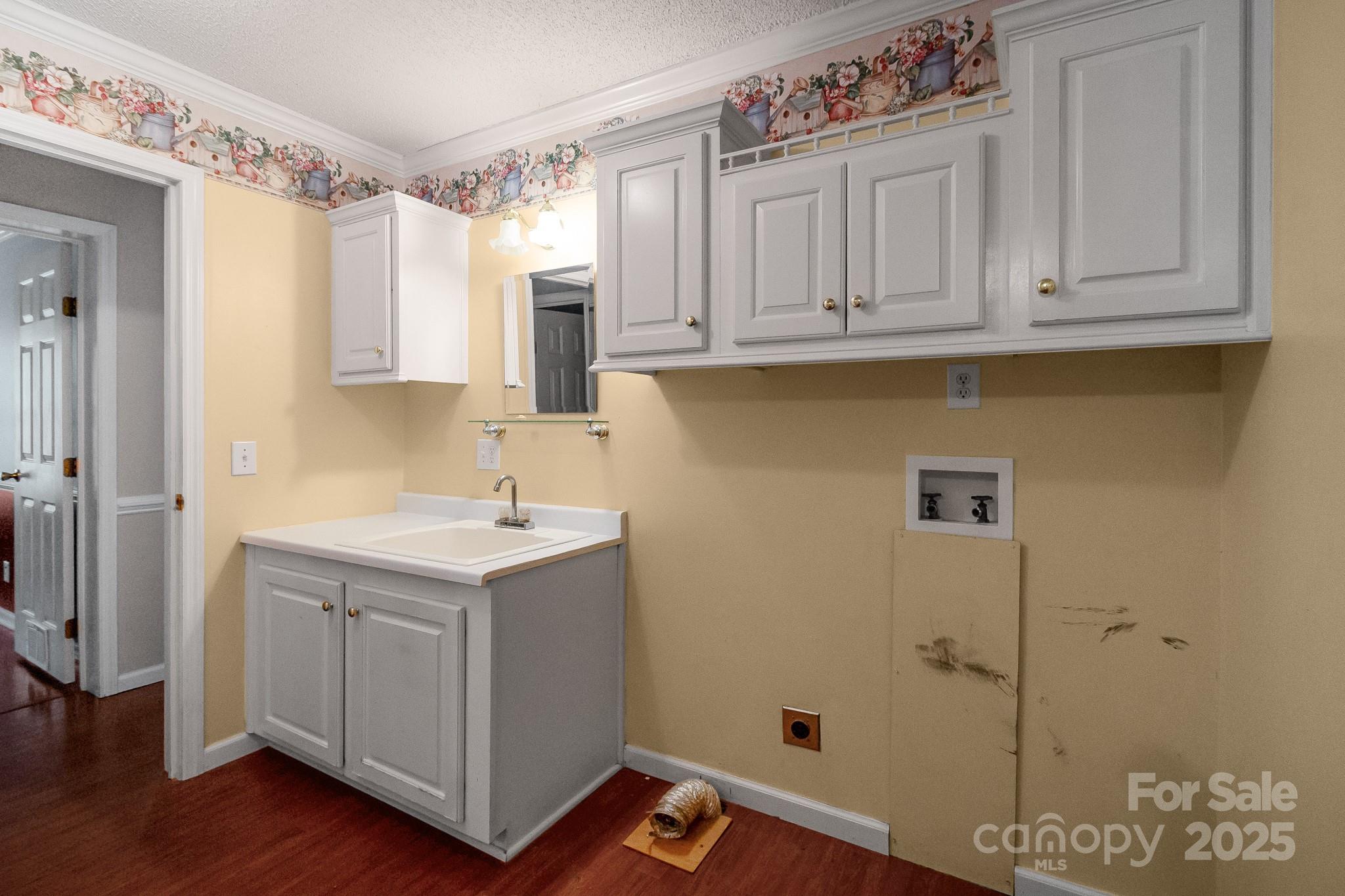 2716 Camp Creek Road Lancaster, SC 29720 - Photo 23 of 47 a view of cabinets with wooden floor