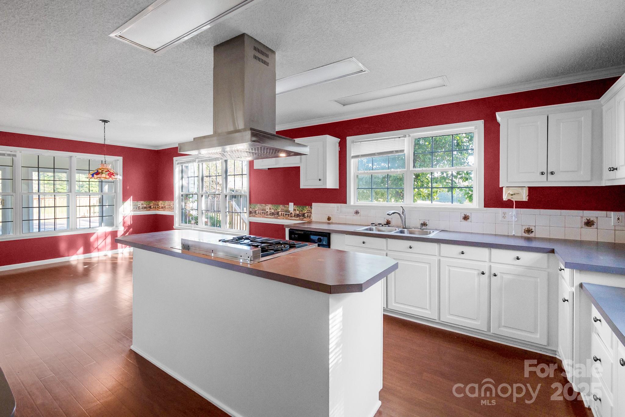 2716 Camp Creek Road Lancaster, SC 29720 - Photo 26 of 47 a kitchen with granite countertop a sink cabinets and window