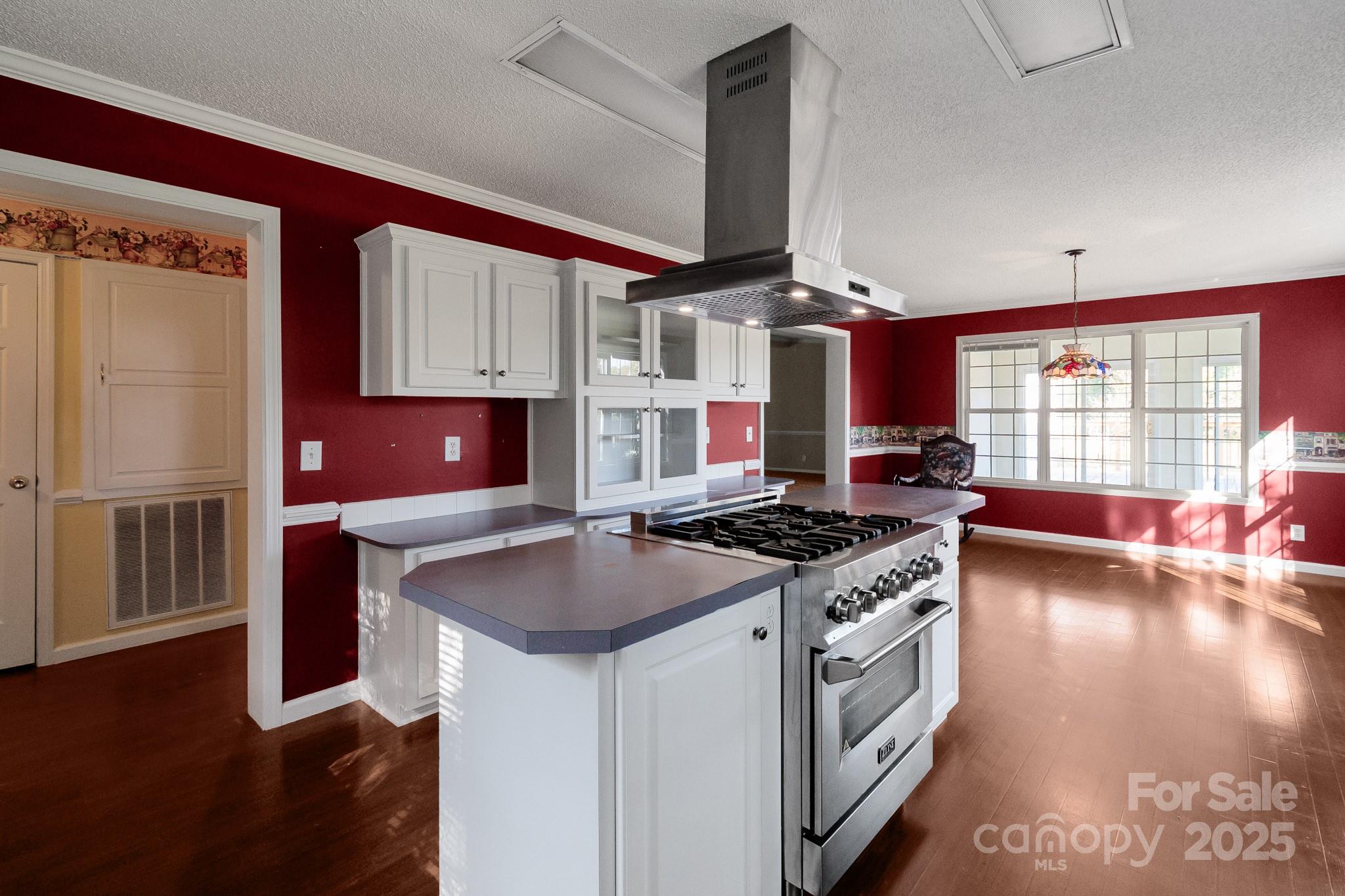 2716 Camp Creek Road Lancaster, SC 29720 - Photo 28 of 47 a kitchen with stainless steel appliances granite countertop a stove sink and cabinets
