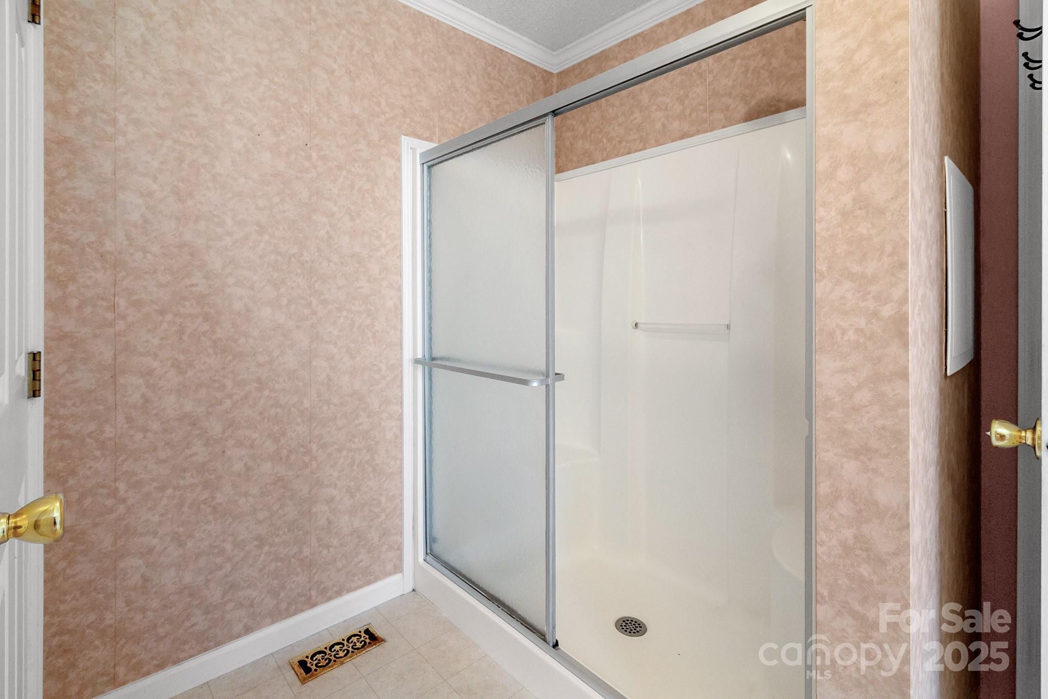 2716 Camp Creek Road Lancaster, SC 29720 - Photo 32 of 47 a bathroom with a glass shower door