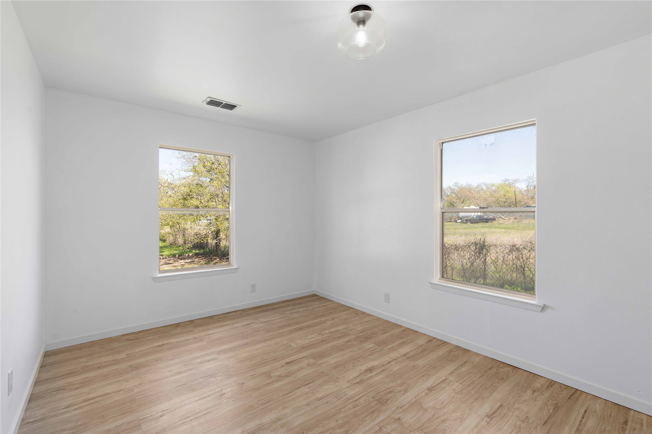 1604 5th Street Goldthwaite, TX 76844 - Photo 14 of 23 an empty room with windows