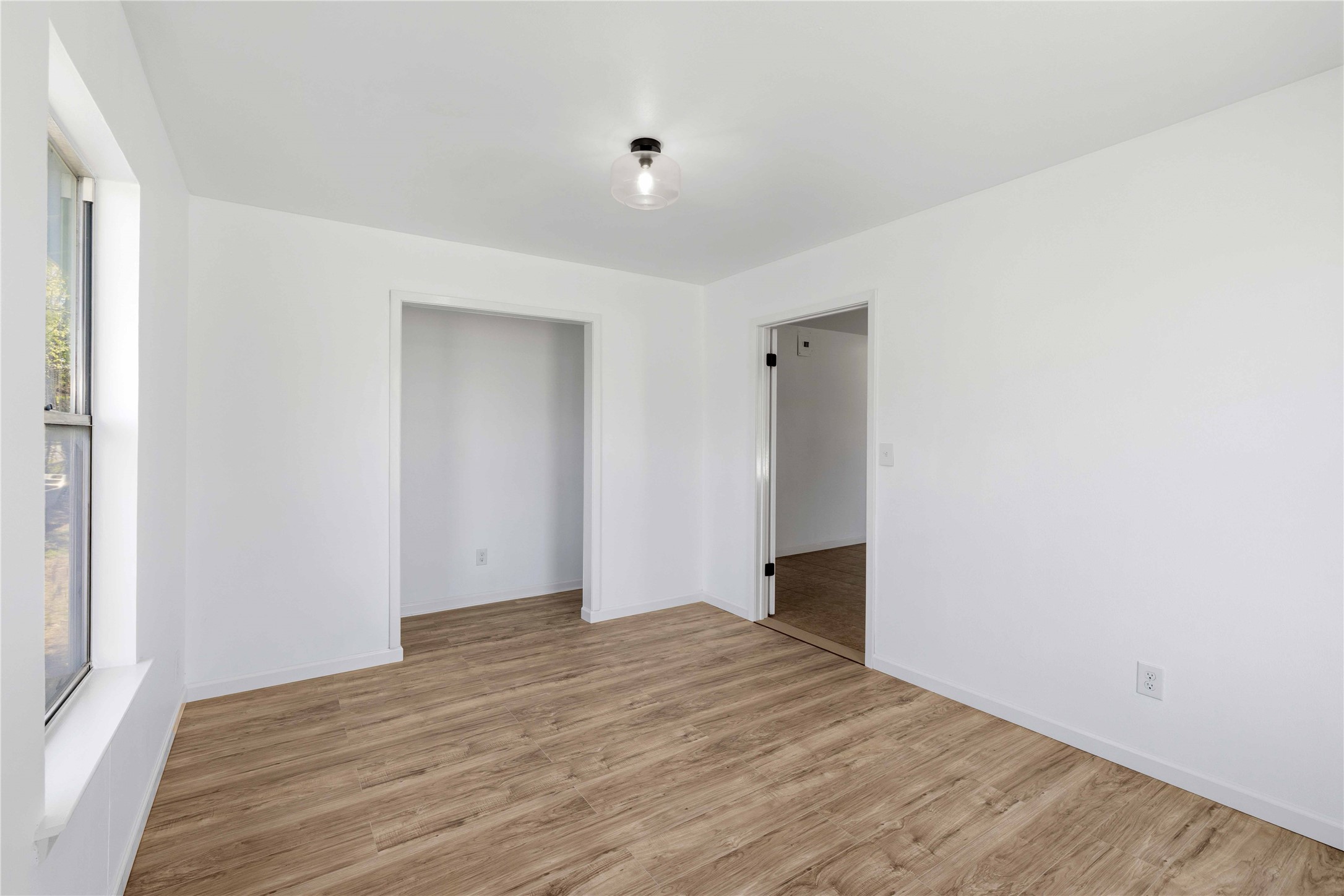 1604 5th Street Goldthwaite, TX 76844 - Photo 18 of 23 a view of empty room with wooden floor