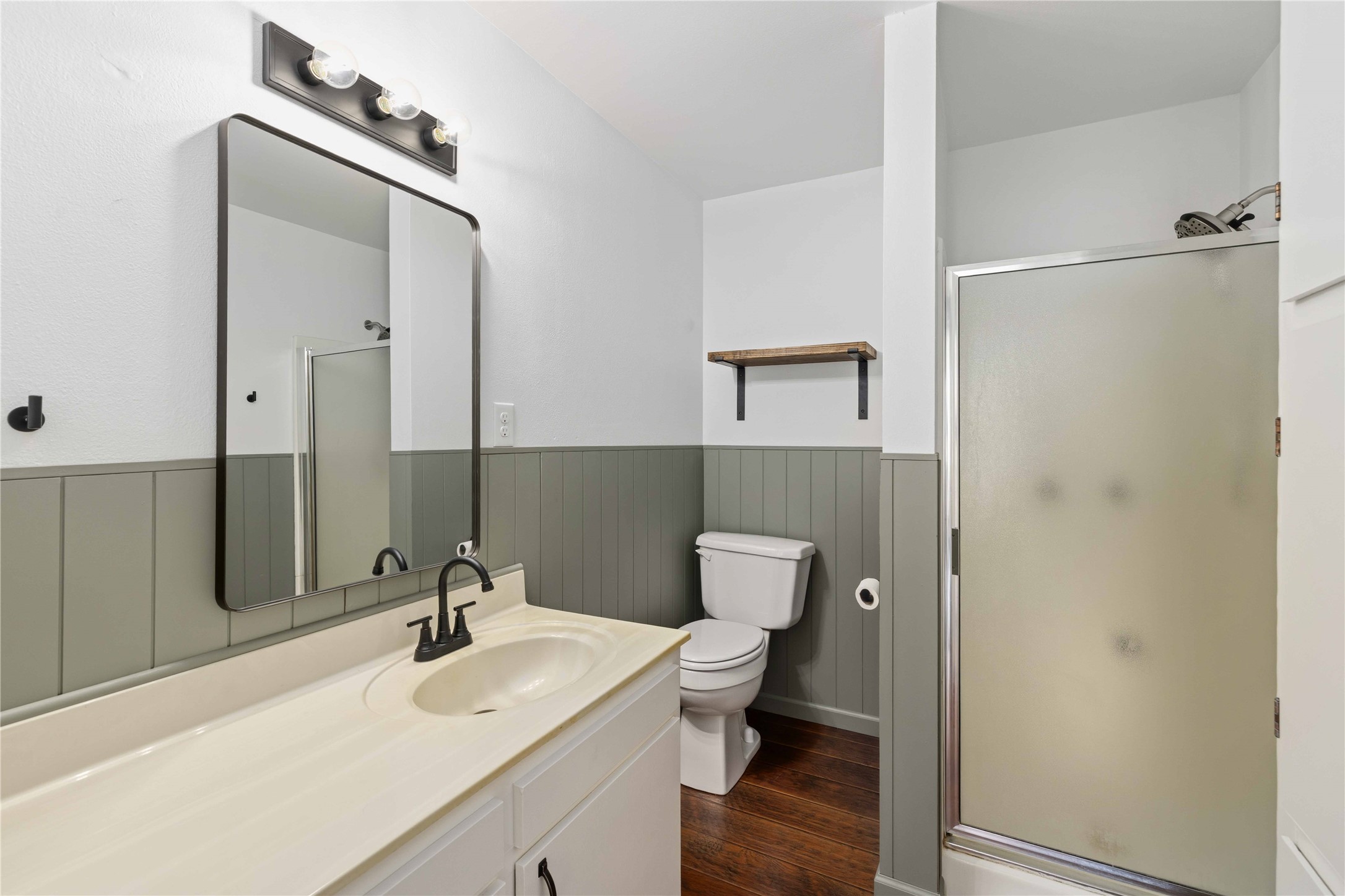 1604 5th Street Goldthwaite, TX 76844 - Photo 19 of 23 a bathroom with a sink a toilet and shower