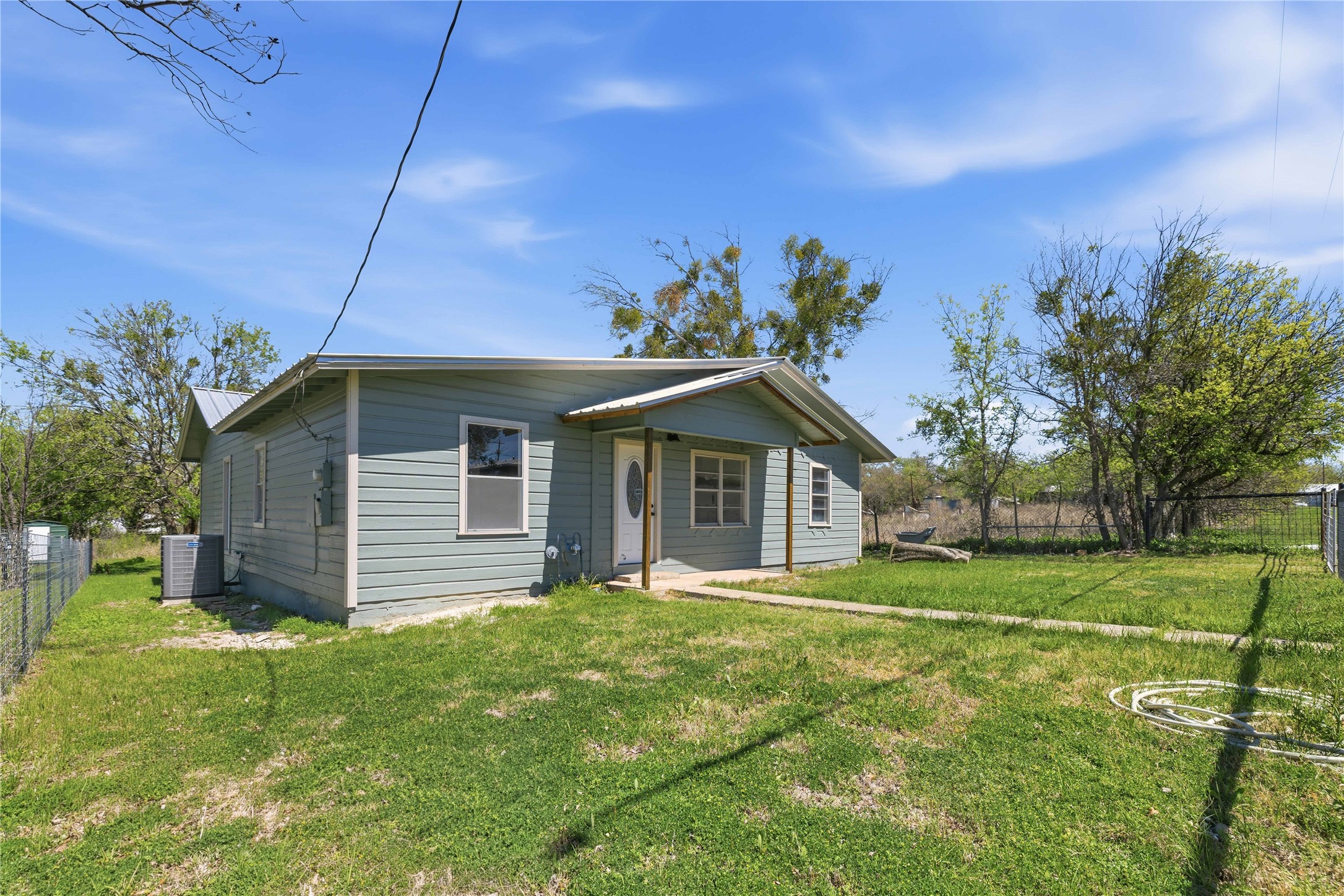 1604 5th Street Goldthwaite, TX 76844 - Photo 5 of 23 a front view of a house with a garden