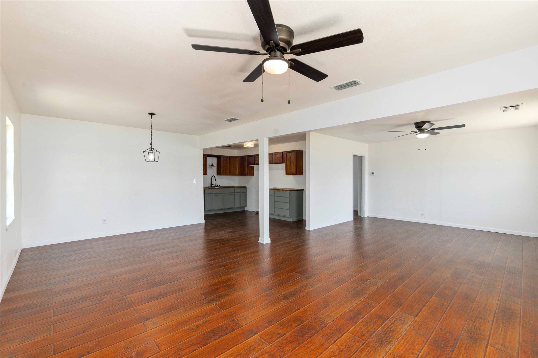 1604 5th Street Goldthwaite, TX 76844 - Photo 9 of 23 a view of empty room with wooden floor