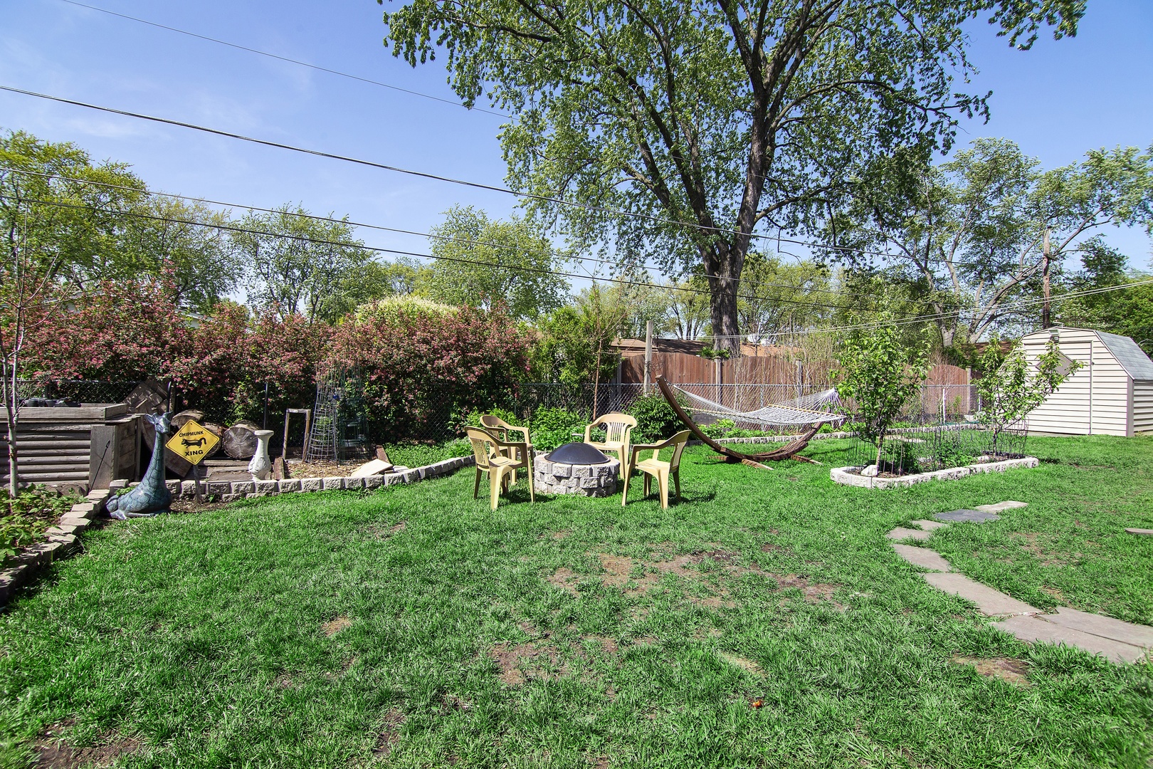 936 Pebble Drive Wheeling, IL 60090 - Photo 20 of 27 a view of a chair and table in the garden