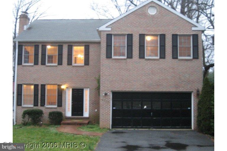 8910 Old Georgetown Road Bethesda, MD 20814 - Photo 1 of 1 a front view of a house with garden