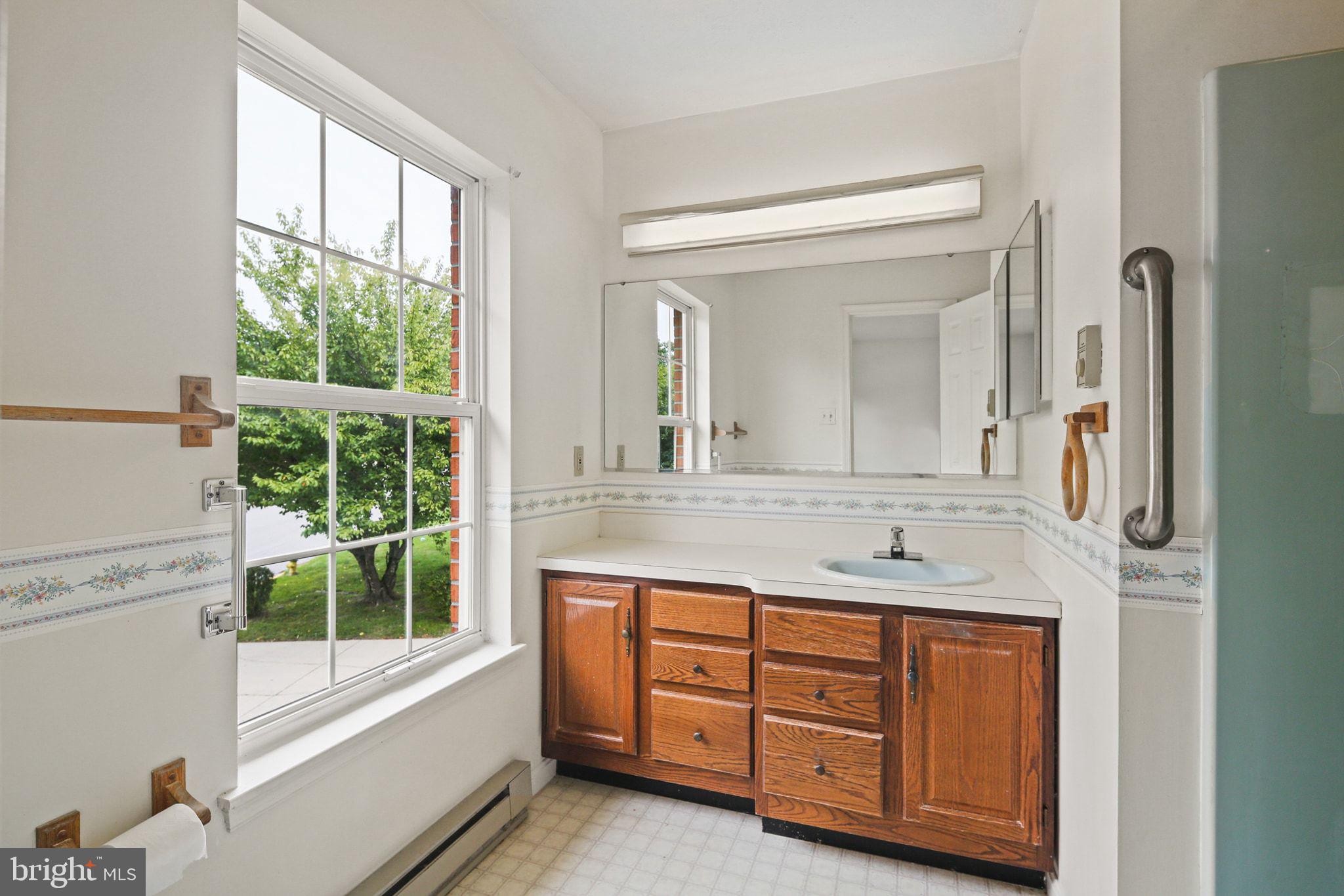 61 Marhill Court Westminster, MD 21158 - Photo 23 of 33 a bathroom with a granite countertop sink window and a large mirror