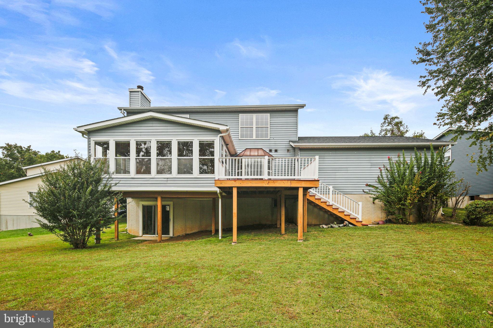 61 Marhill Court Westminster, MD 21158 - Photo 27 of 33 a front view of a house with a yard table and chairs