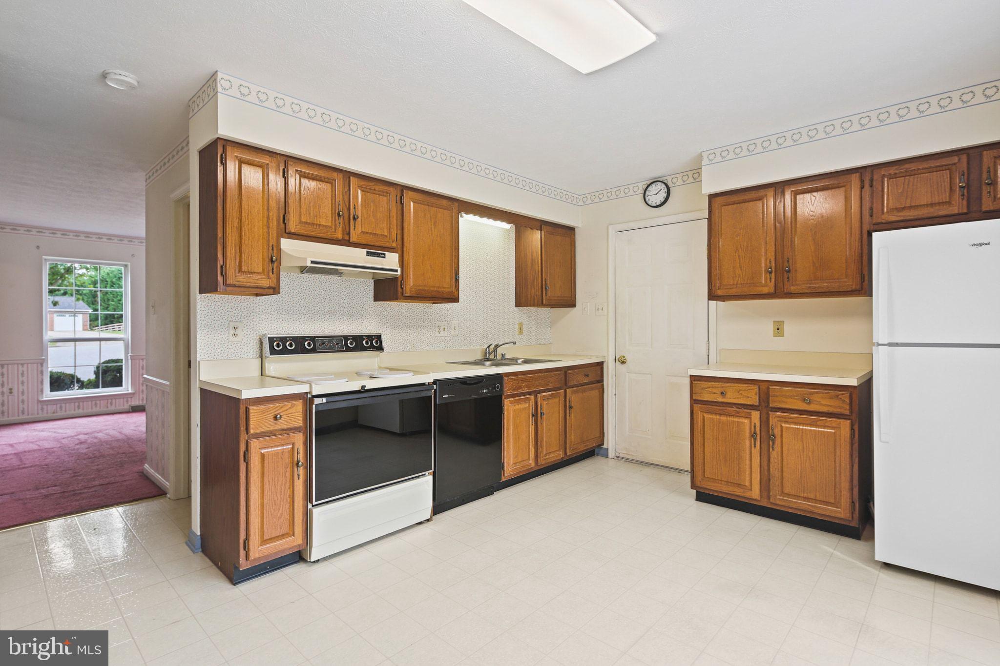 61 Marhill Court Westminster, MD 21158 - Photo 7 of 33 a kitchen with stainless steel appliances granite countertop a stove a sink and a refrigerator