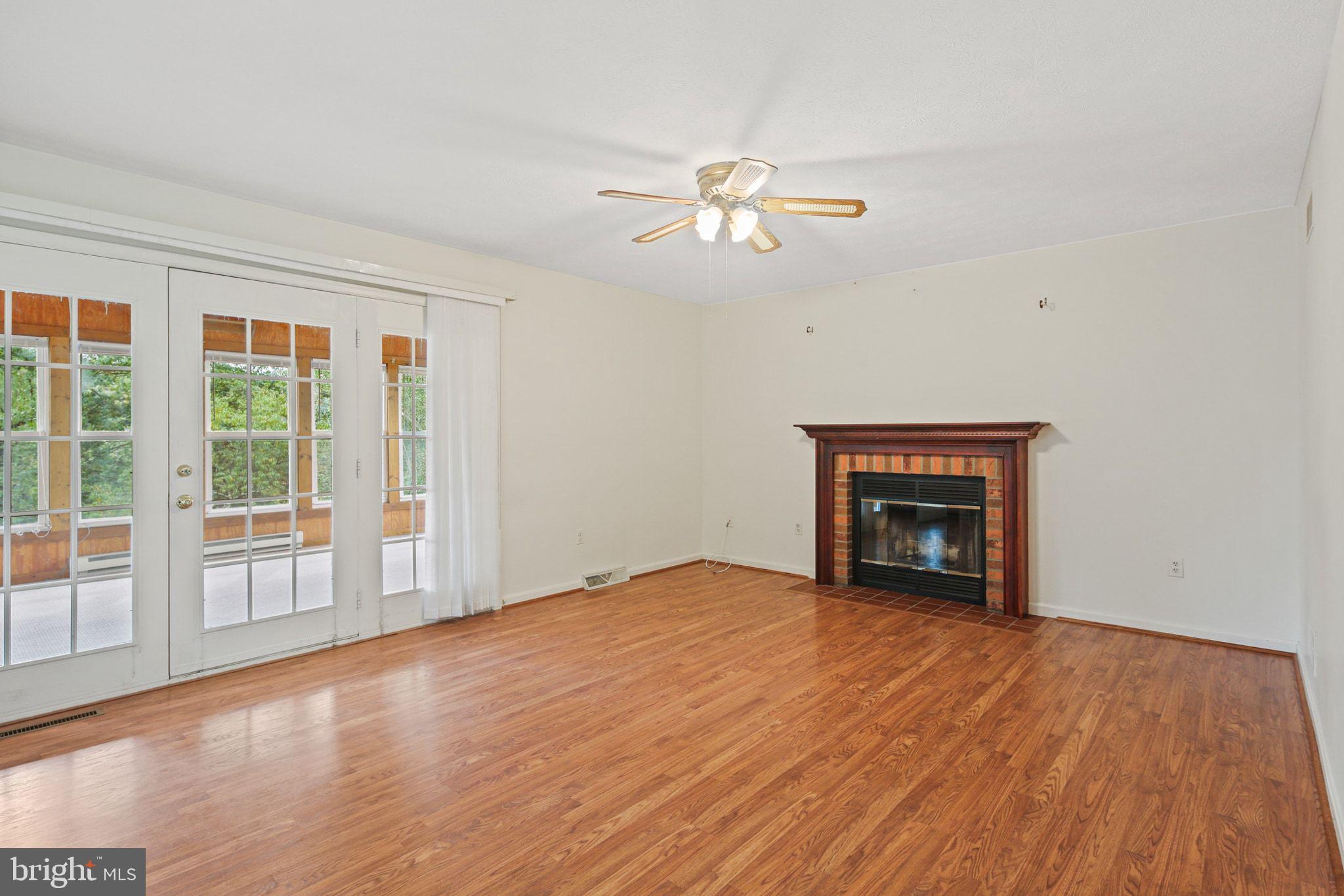 61 Marhill Court Westminster, MD 21158 - Photo 8 of 33 a view of empty room with wooden floor and fireplace