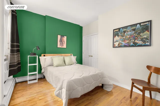 a bedroom with a bed and a table