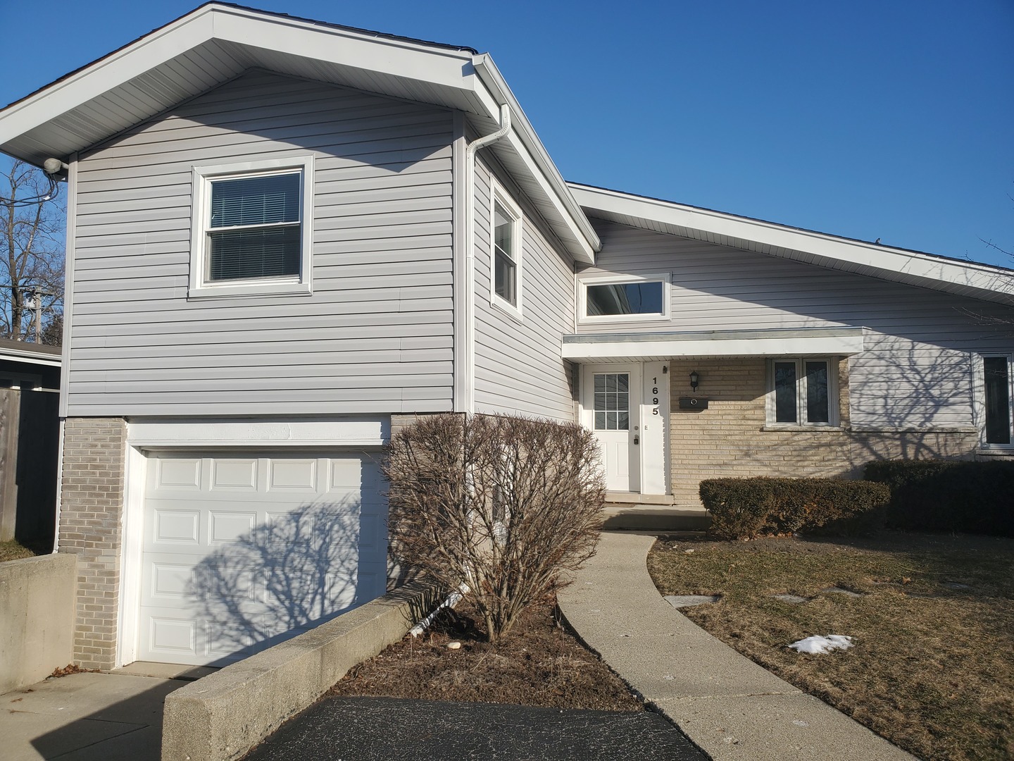 1695 Clavey Road Highland Park, IL 60035 - Photo 1 of 24 a front view of a house with a yard