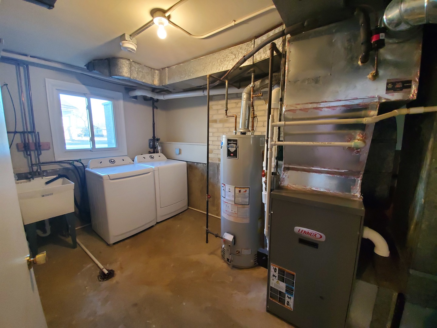 1695 Clavey Road Highland Park, IL 60035 - Photo 22 of 24 a room with water heater refrigerator washer and dryer