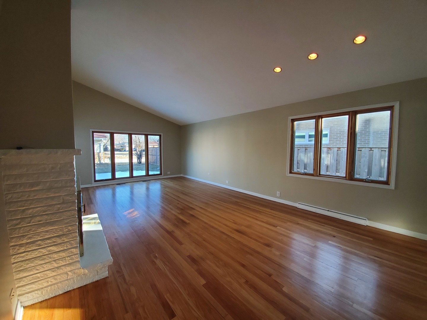 1695 Clavey Road Highland Park, IL 60035 - Photo 4 of 24 a view of an empty room with wooden floor and a window