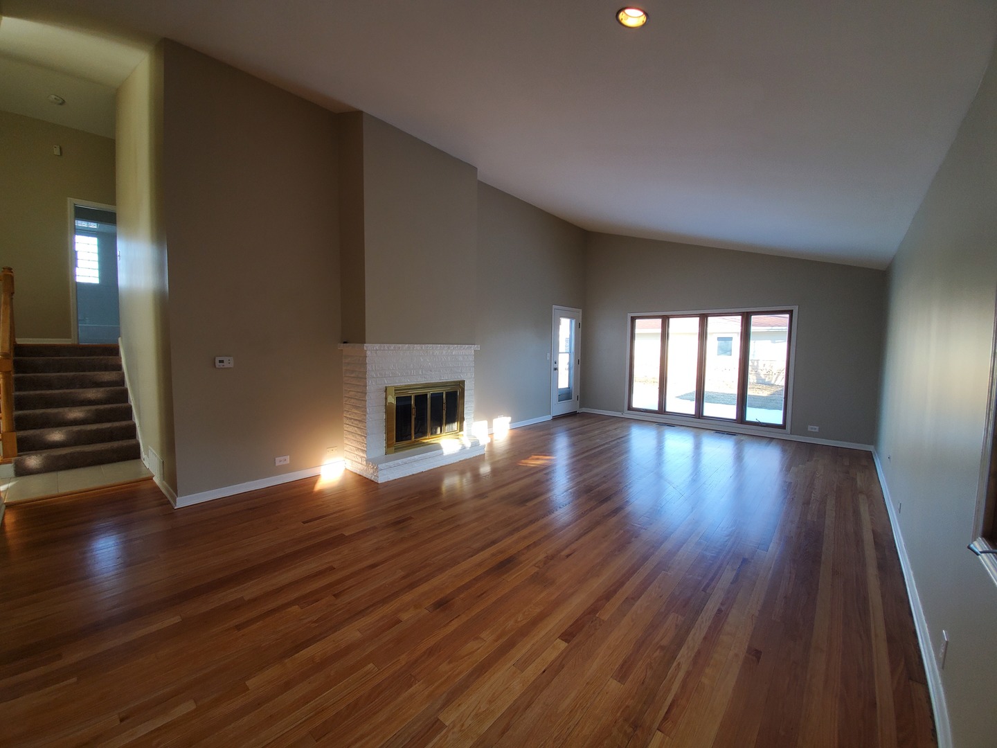 1695 Clavey Road Highland Park, IL 60035 - Photo 5 of 24 a view of an empty room with wooden floor and a window