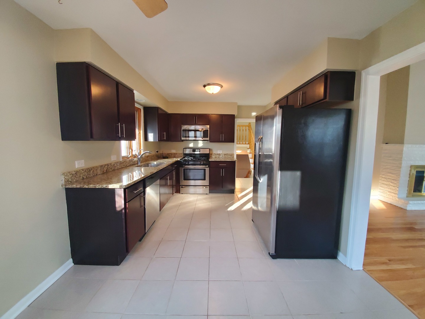 1695 Clavey Road Highland Park, IL 60035 - Photo 9 of 24 a kitchen with stainless steel appliances granite countertop a refrigerator and a stove