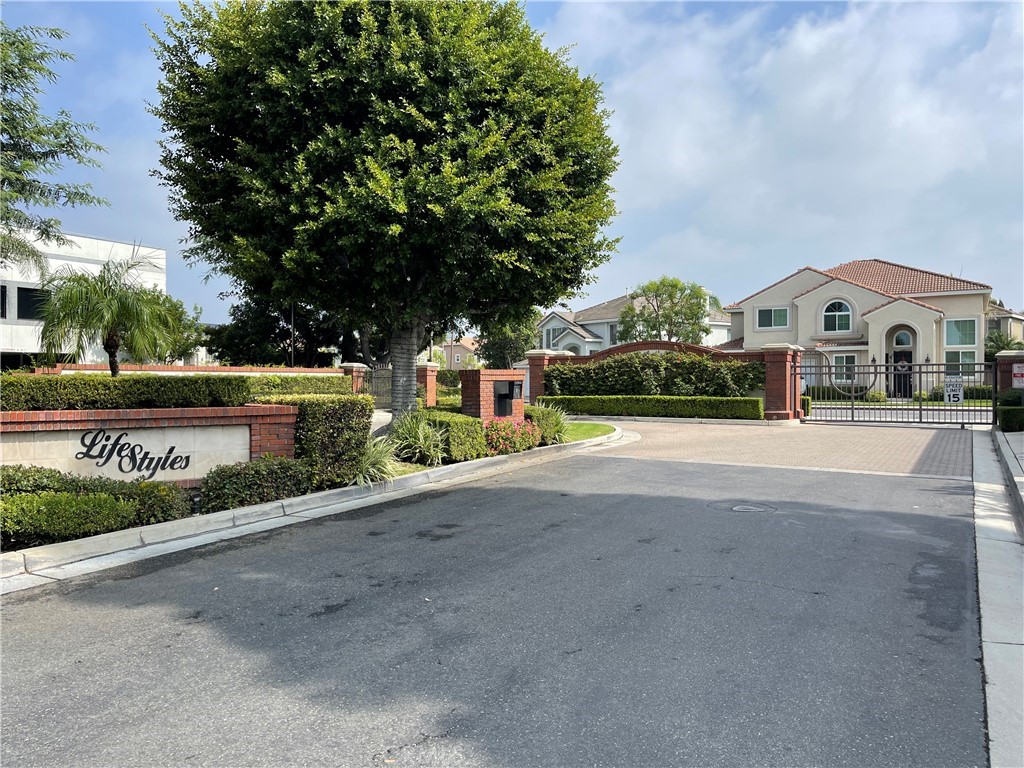 3095 Promenade Costa Mesa, CA 92626 - Photo 1 of 10 a front view of a house with a yard
