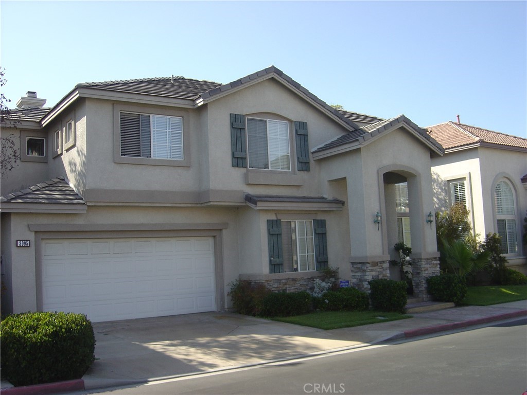 3095 Promenade Costa Mesa, CA 92626 - Photo 3 of 10 a front view of a house with garden