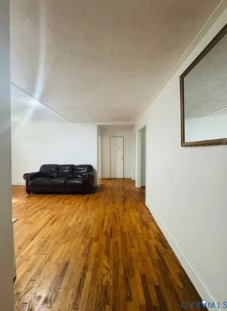 a bed sitting in a room next to a window