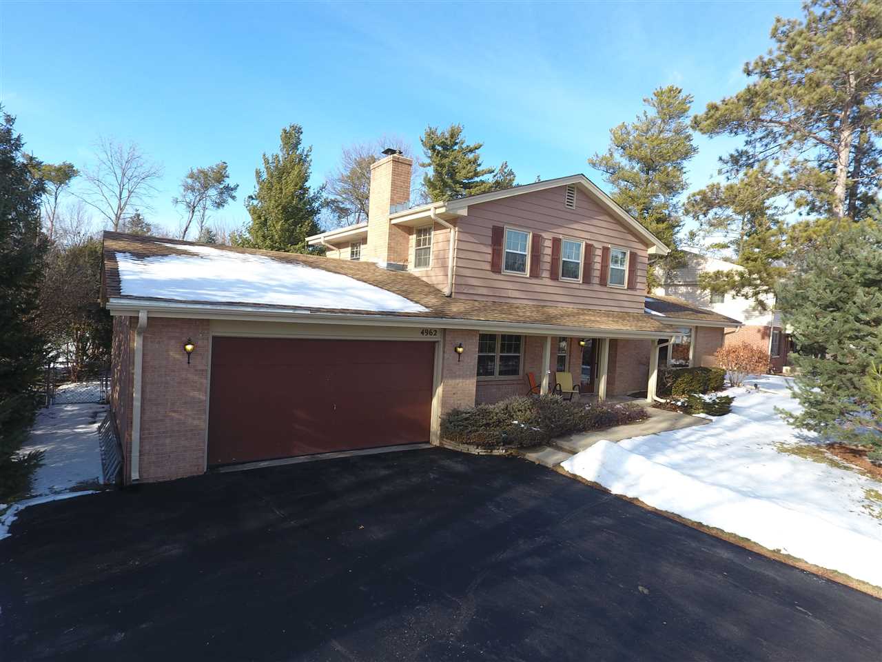 4962 Brookview Road Rockford, IL 61107 - Photo 1 of 7 a front view of house with yard and trees in the background