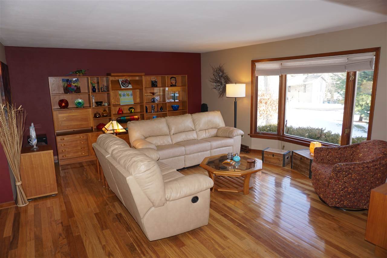 4962 Brookview Road Rockford, IL 61107 - Photo 2 of 7 a living room with furniture and a large window
