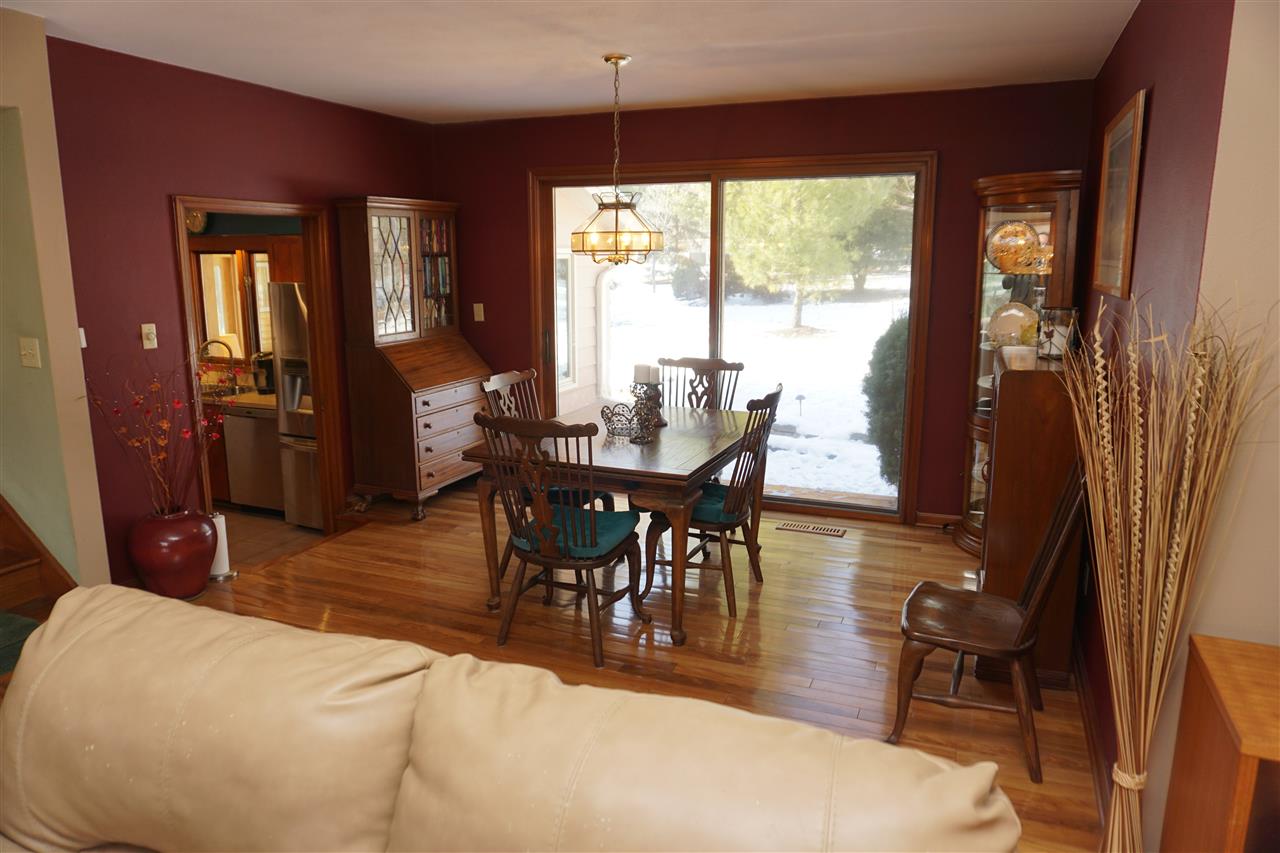 4962 Brookview Road Rockford, IL 61107 - Photo 4 of 7 a dining room with furniture window wooden floor