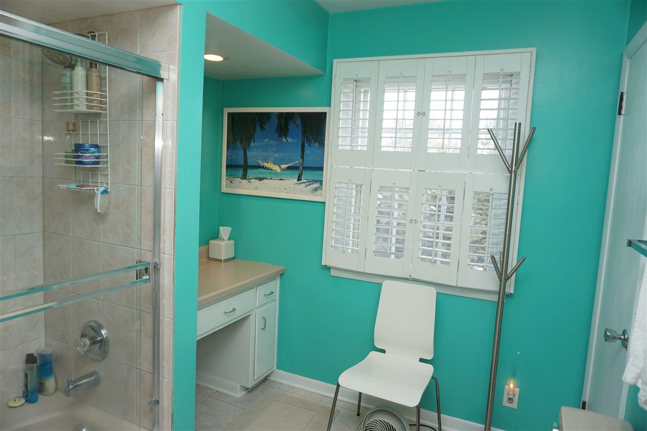 4962 Brookview Road Rockford, IL 61107 - Photo 5 of 7 a bathroom with a sink a toilet and shower