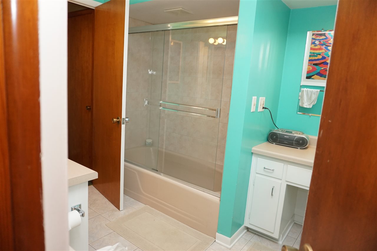 4962 Brookview Road Rockford, IL 61107 - Photo 6 of 7 a bathroom with a shower and a sink