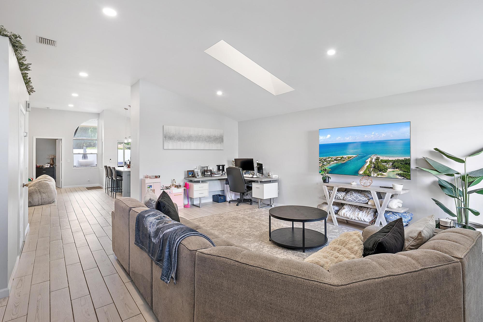 159 St Michaels Court Jupiter, FL 33458 - Photo 11 of 22 a living room with furniture and a flat screen tv