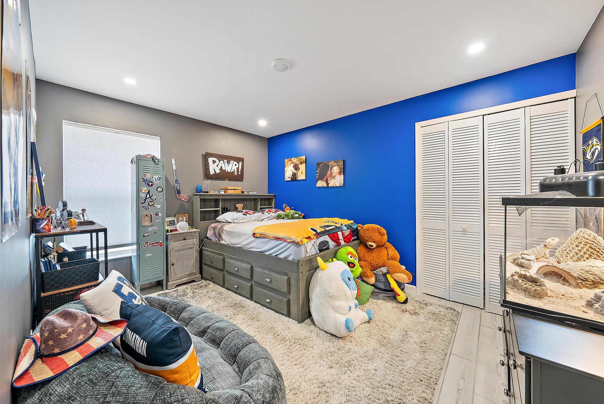 159 St Michaels Court Jupiter, FL 33458 - Photo 16 of 22 a bedroom with bed and a couch