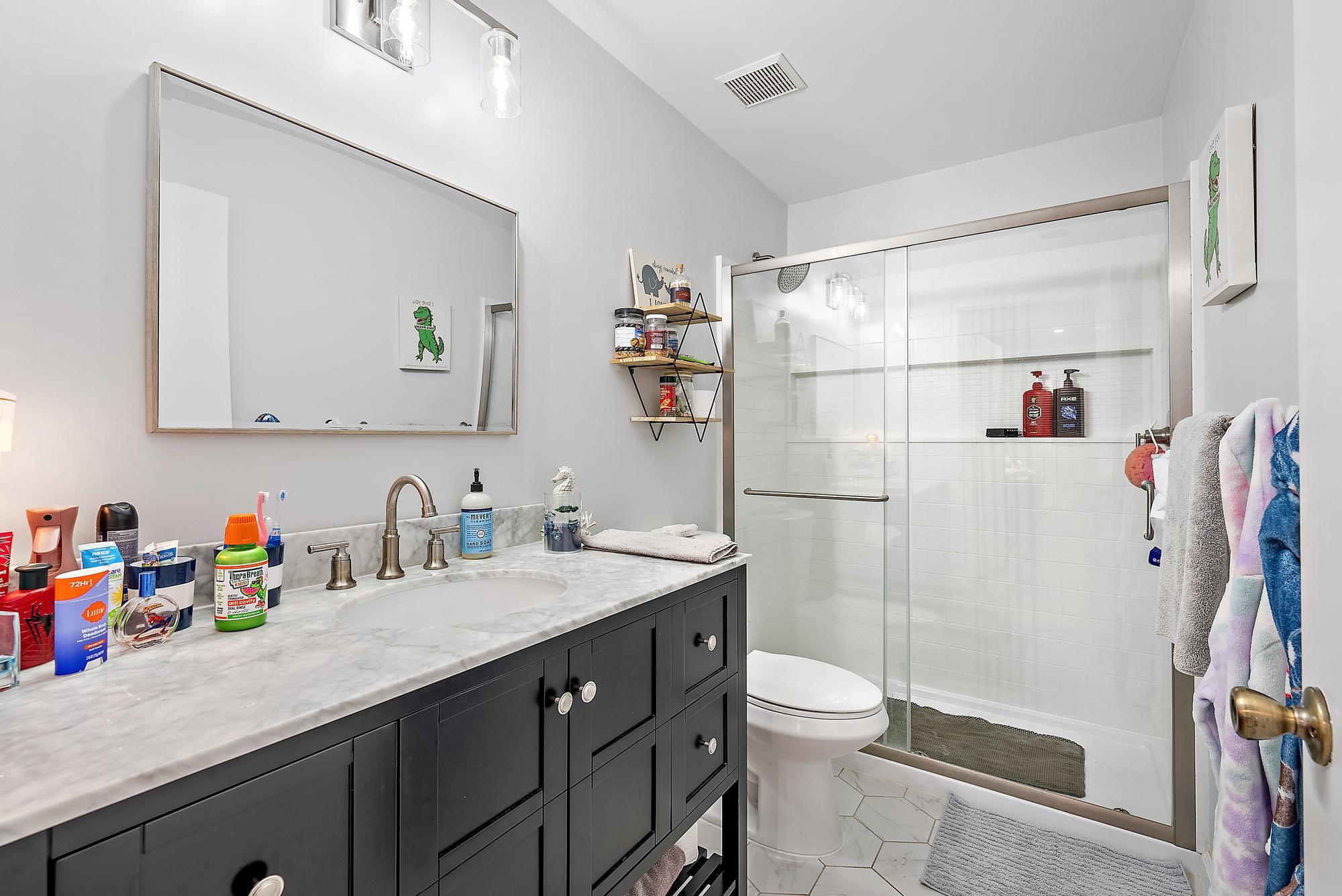 159 St Michaels Court Jupiter, FL 33458 - Photo 17 of 22 a bathroom with a sink a toilet and shower